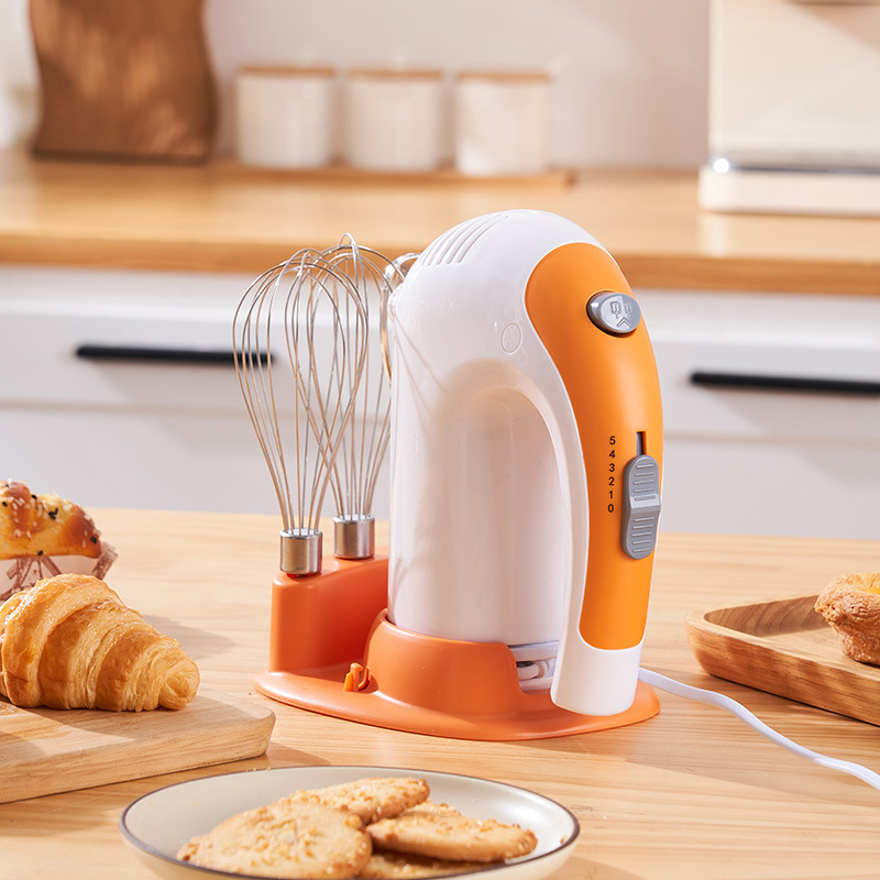 Electric egg beater with holder